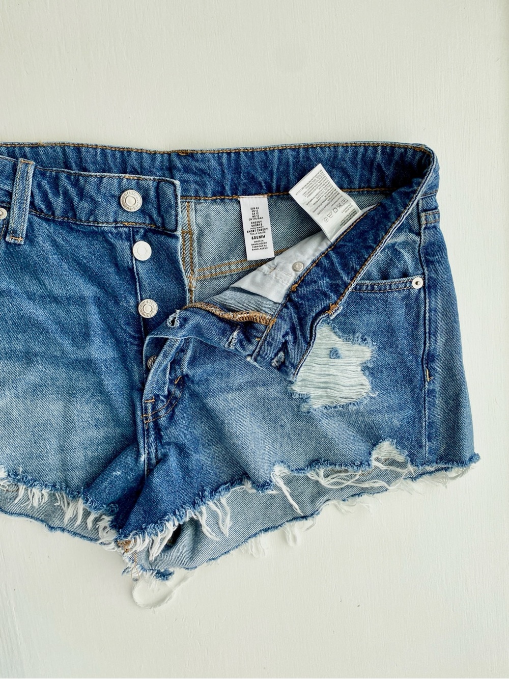 &Denim High-Rise Distressed Denim Shorts in Medium Blue